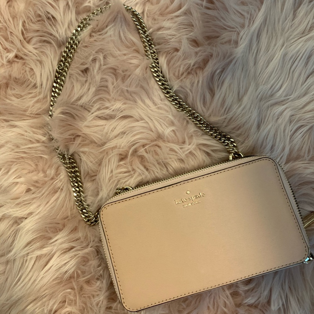Blush pink Kate Spade purse.